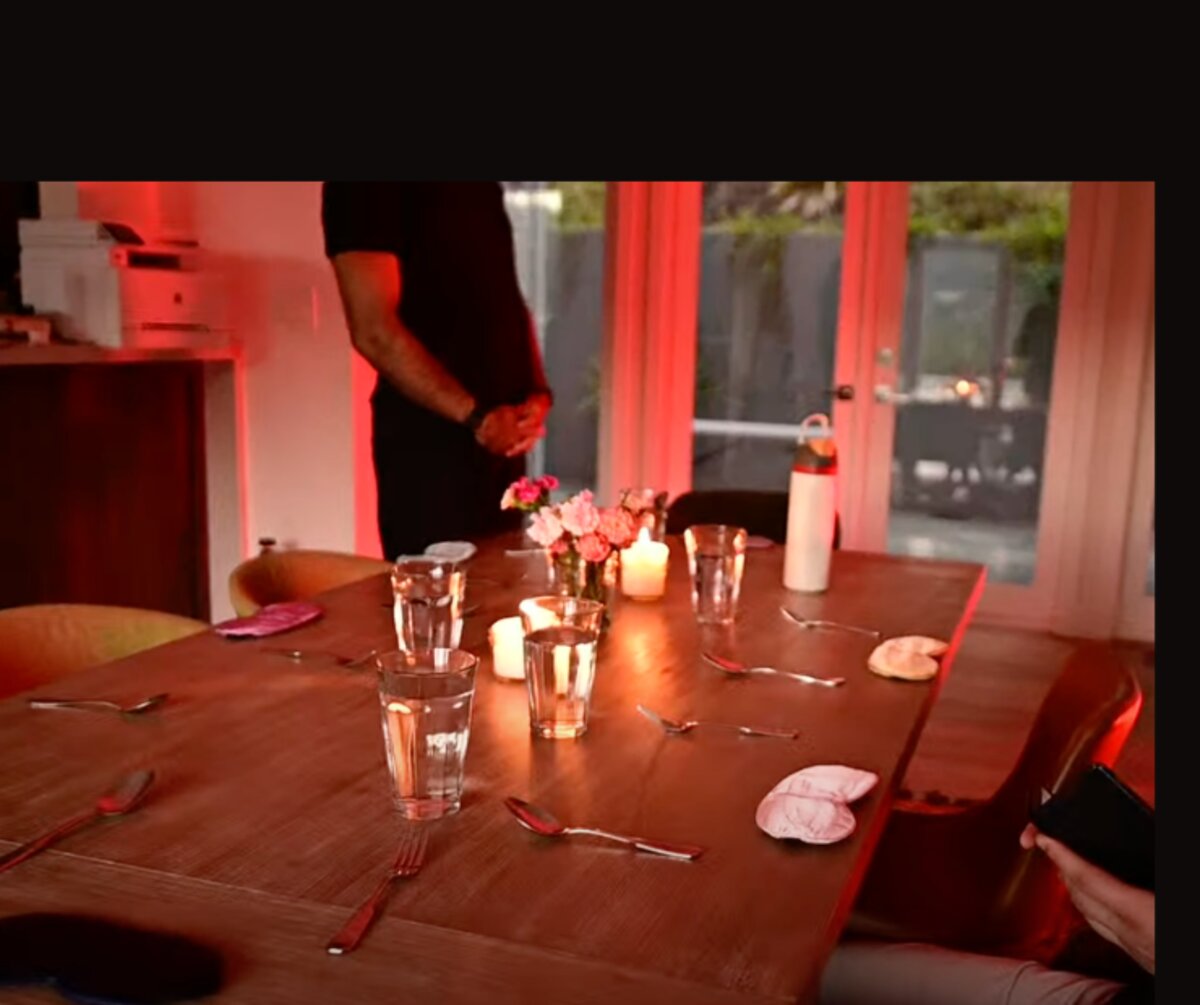 A candle-lit table set for the evening